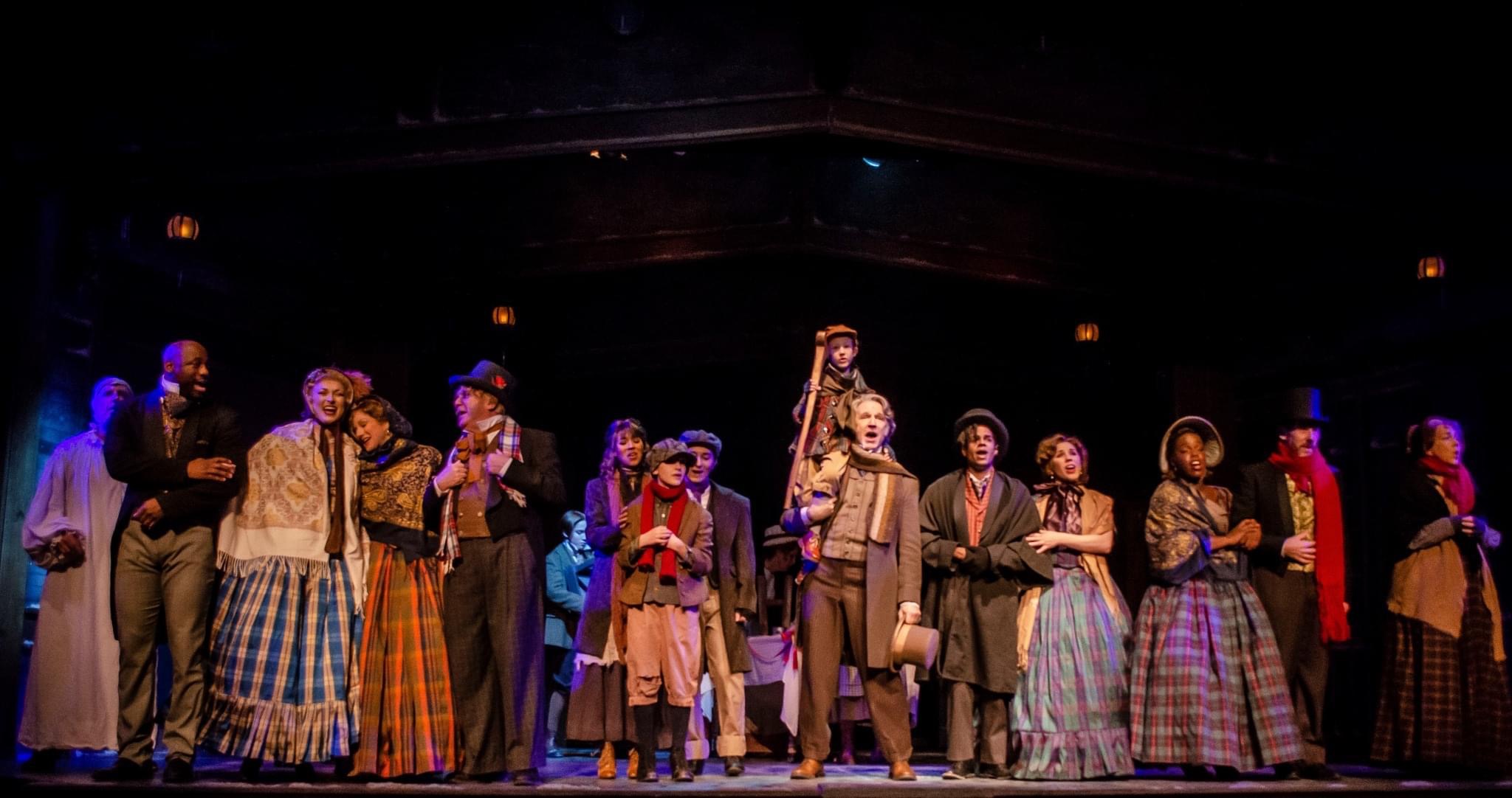 As Bob Cratchit (center) with the 2022 company of A CHRISTMAS CAROL at Arrow Rock Lyceum Theatre. Photo by Ryan J. Zimgibl.
